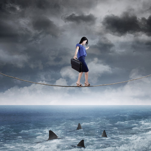 Businesswoman walk above ocean
