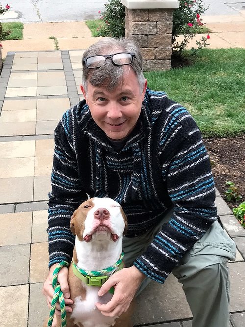  Michael with his foster pit bull, Toby. 